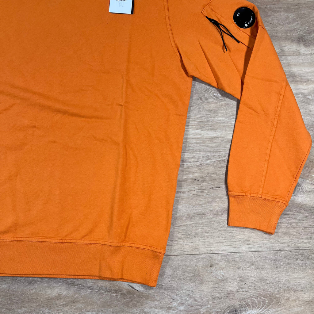 CP Company Light Fleece Crewneck Lens Sweatshirt in Russet Orange